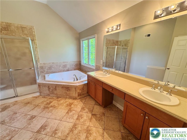 4620 Graystone Dr, Lower Nazareth Twp, PA 18064 - bathroom with double vanity, vaulted ceiling, a shower stall, a whirlpool tub, and tile patterned flooring