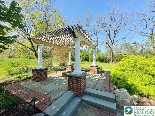 4620 Graystone Dr, Lower Nazareth Twp, PA 18064 - covered porch with a pergola and a lawn