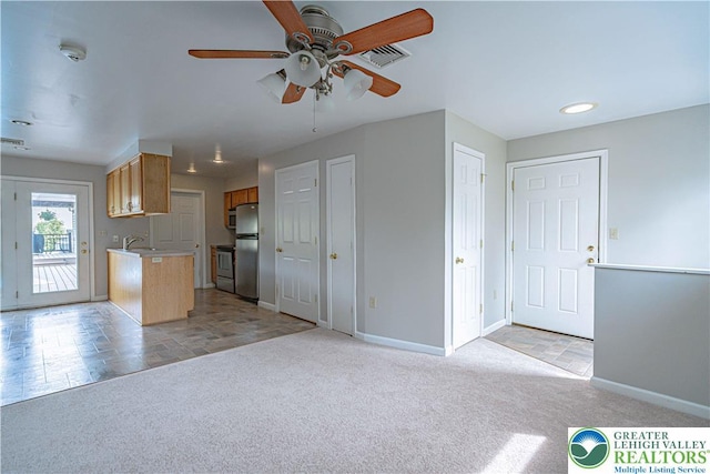 3624 Mcintosh Dr, North Whitehall Twp, PA 18069 - kitchen with a sink, light colored carpet, appliances with stainless steel finishes, and ceiling fan