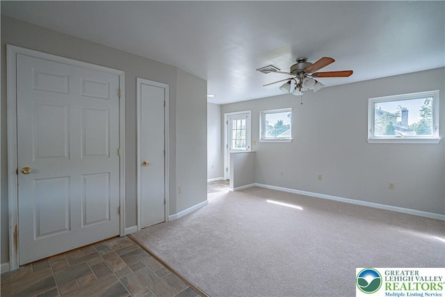 3624 Mcintosh Dr, North Whitehall Twp, PA 18069 - unfurnished bedroom with baseboards, carpet flooring, and ceiling fan
