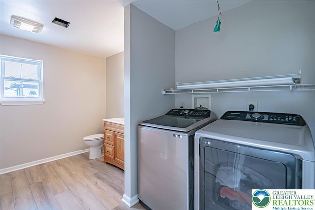 3624 Mcintosh Dr, North Whitehall Twp, PA 18069 - washroom with independent washer and dryer, light wood-type flooring, and baseboards