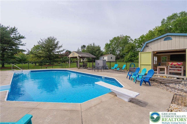 3624 Mcintosh Dr, North Whitehall Twp, PA 18069 - view of swimming pool with a gazebo, a patio area, a diving board, and an outdoor structure