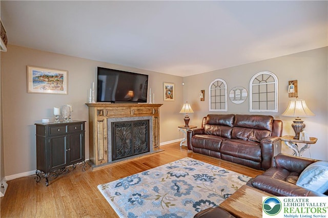 3624 Mcintosh Dr, North Whitehall Twp, PA 18069 - living area with light wood-style floors, a high end fireplace, and baseboards