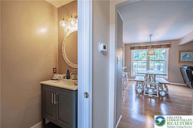 3624 Mcintosh Dr, North Whitehall Twp, PA 18069 - bathroom with vanity, baseboards, and wood finished floors