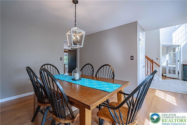 3624 Mcintosh Dr, North Whitehall Twp, PA 18069 - dining room featuring wood finished floors, a chandelier, and baseboards