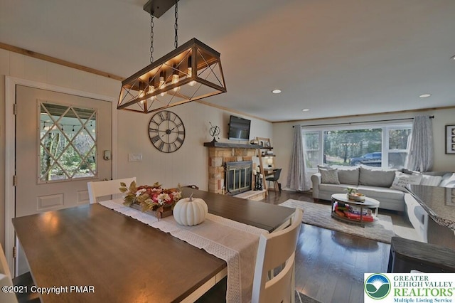 36 Maplewood Rd, Kidder Township S, PA 18624 - dining space featuring wood finished floors, a chandelier, a stone fireplace, ornamental molding, and recessed lighting