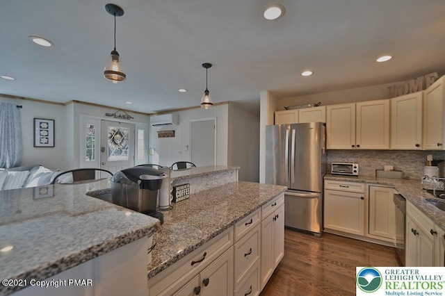 36 Maplewood Rd, Kidder Township S, PA 18624 - kitchen featuring stainless steel appliances, an AC wall unit, recessed lighting, decorative backsplash, and hanging light fixtures