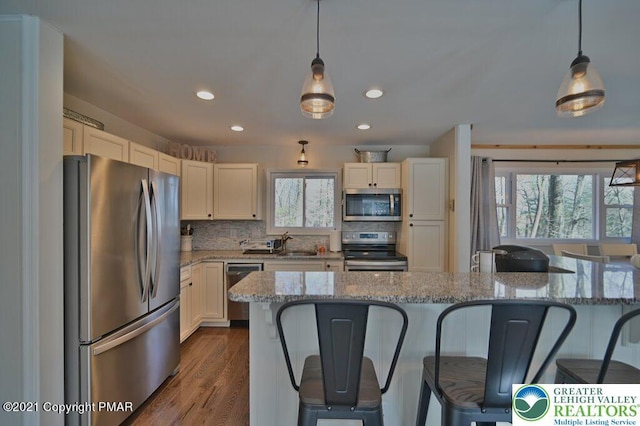 36 Maplewood Rd, Kidder Township S, PA 18624 - kitchen with appliances with stainless steel finishes, a sink, a kitchen breakfast bar, recessed lighting, and decorative backsplash