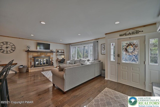 36 Maplewood Rd, Kidder Township S, PA 18624 - living area with ornamental molding, plenty of natural light, wood finished floors, a glass covered fireplace, and recessed lighting