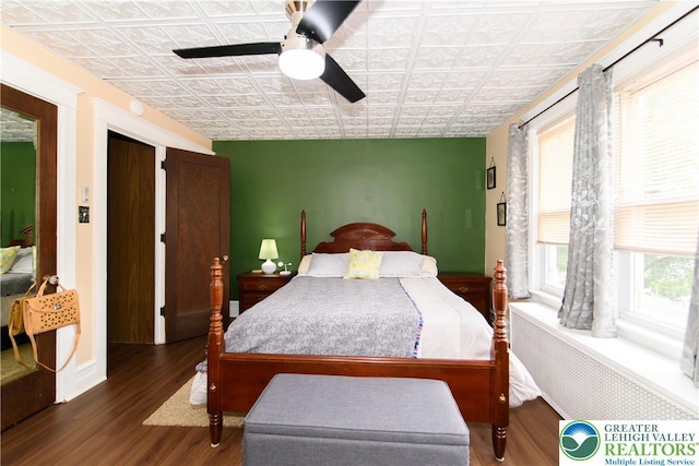 1241 Lehigh St, Allentown City, PA 18103 - bedroom with an ornate ceiling, wood finished floors, a ceiling fan, and radiator