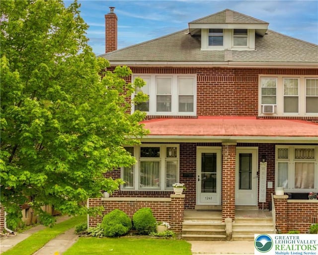 1241 Lehigh St, Allentown City, PA 18103 - view of front of home with brick siding, a chimney, a shingled roof, and covered porch