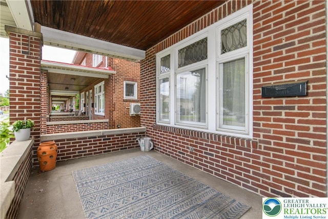 1241 Lehigh St, Allentown City, PA 18103 - covered porch featuring an AC wall unit