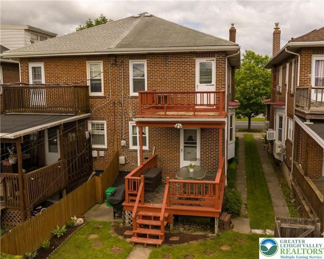 1241 Lehigh St, Allentown City, PA 18103 - rear view of property with brick siding, a balcony, a shingled roof, and cooling unit