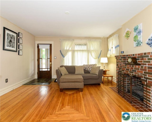 1241 Lehigh St, Allentown City, PA 18103 - living area with a fireplace, baseboards, and crown molding