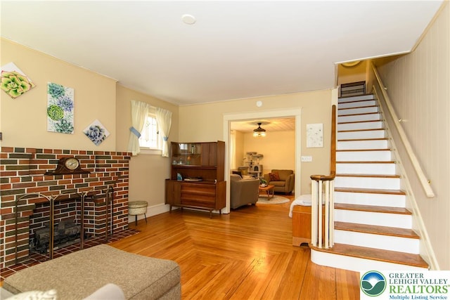 1241 Lehigh St, Allentown City, PA 18103 - living room featuring stairs and a brick fireplace