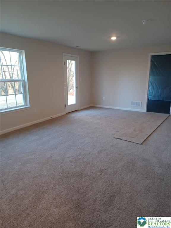 311 Knollwood Dr, Forks Twp, PA 18040 - carpeted empty room featuring baseboards and recessed lighting