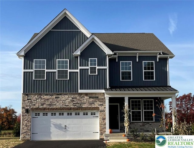 311 Knollwood Dr, Forks Twp, PA 18040 - view of front of property featuring stone siding, an attached garage, board and batten siding, and driveway