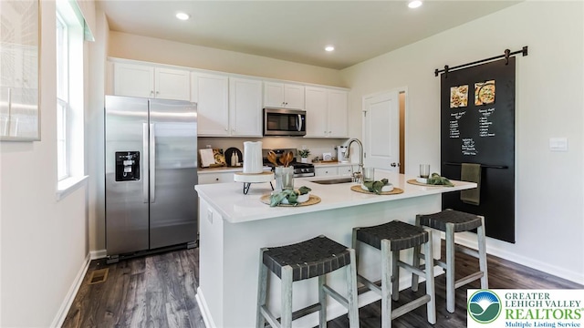 311 Knollwood Dr, Forks Twp, PA 18040 - kitchen featuring stainless steel appliances, a sink, white cabinetry, dark wood finished floors, and recessed lighting