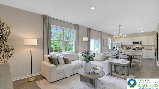 311 Knollwood Dr, Forks Twp, PA 18040 - living room featuring plenty of natural light, a chandelier, light wood finished floors, recessed lighting, and baseboards