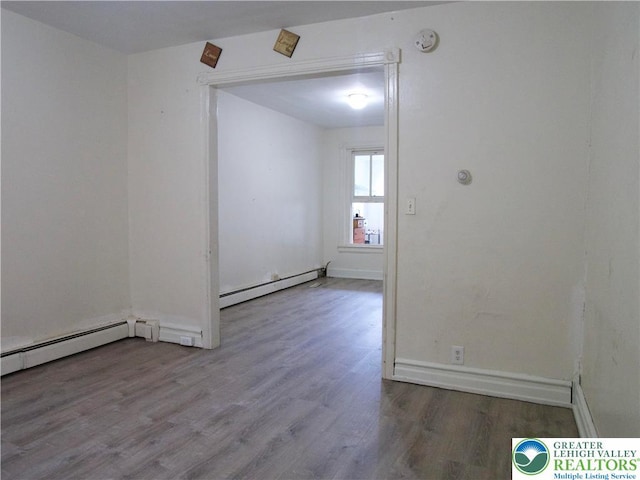 337 N Jordan St, Allentown City, PA 18102 - spare room featuring baseboard heating, wood finished floors, a smoke detector, and baseboards