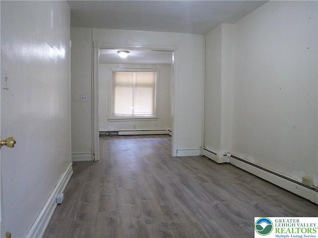 337 N Jordan St, Allentown City, PA 18102 - unfurnished room featuring wood finished floors, a baseboard radiator, baseboard heating, and baseboards