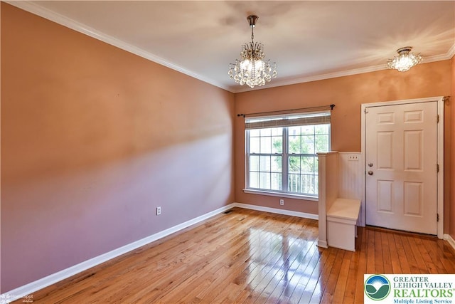 27 Willow Dr, Palmer Twp, PA 18045 - entrance foyer featuring a chandelier, light wood finished floors, baseboards, and ornamental molding