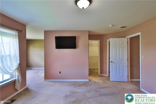 27 Willow Dr, Palmer Twp, PA 18045 - unfurnished bedroom with carpet floors, multiple windows, and a spacious closet