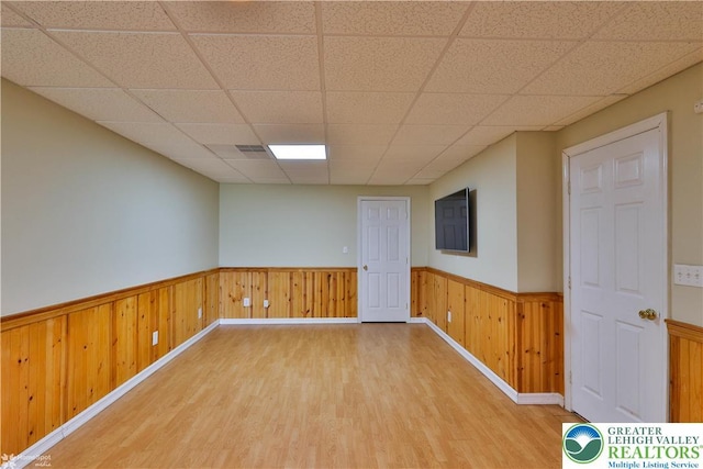 27 Willow Dr, Palmer Twp, PA 18045 - spare room featuring wainscoting, light wood finished floors, and a drop ceiling