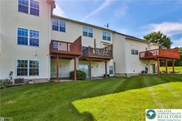 27 Willow Dr, Palmer Twp, PA 18045 - rear view of house with a yard, central air condition unit, and a wooden deck