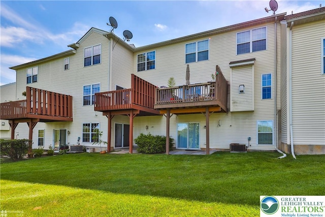 27 Willow Dr, Palmer Twp, PA 18045 - back of property featuring a yard, cooling unit, and a wooden deck