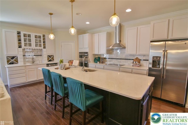 3420 Gentlewind Way Unit Ic 110, Emmaus Borough, PA 18049 - kitchen featuring appliances with stainless steel finishes, wall chimney range hood, tasteful backsplash, white cabinetry, and light countertops