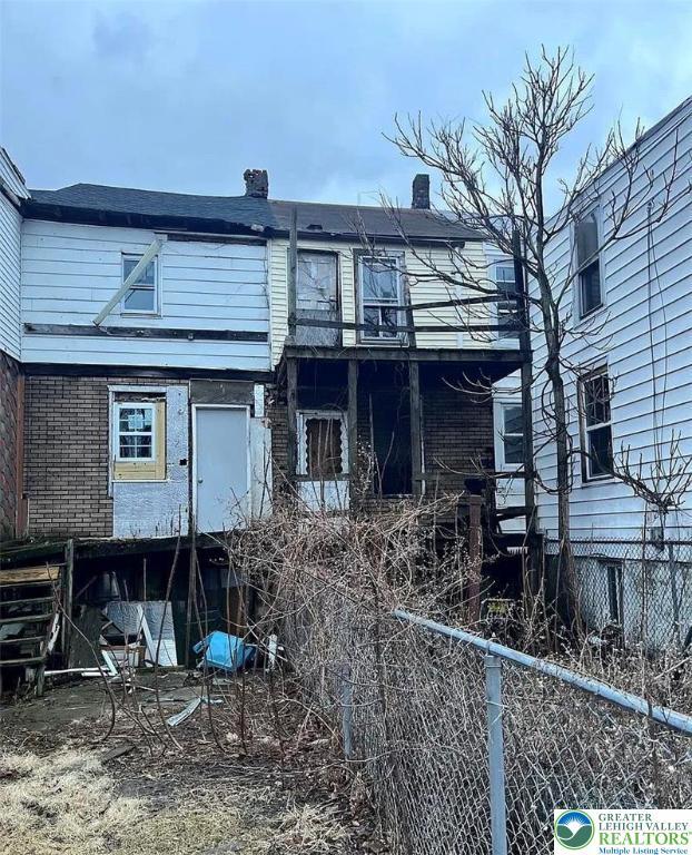 115 N Locust St, Mount Carmel, PA 17851 - rear view of house featuring brick siding