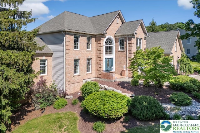1224 Highland Dr, Upper Macungie Twp, PA 18069 - colonial home featuring brick siding and a shingled roof