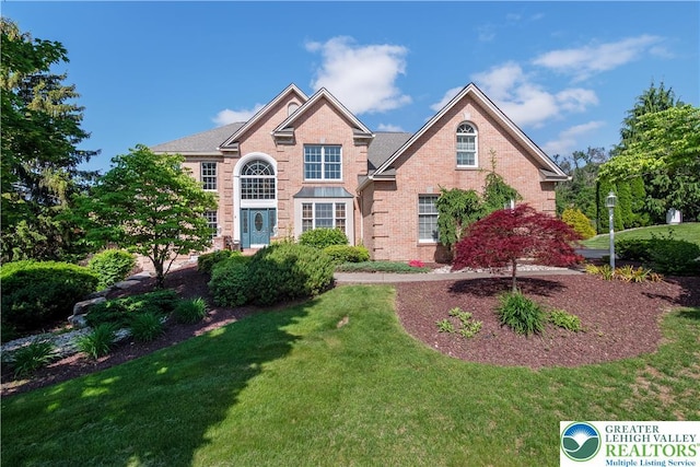 1224 Highland Dr, Upper Macungie Twp, PA 18069 - view of front of house featuring a front lawn and brick siding