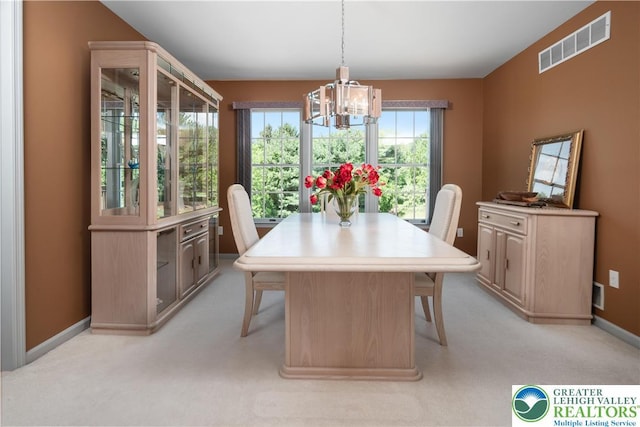 1224 Highland Dr, Upper Macungie Twp, PA 18069 - dining area with a chandelier, light carpet, and baseboards