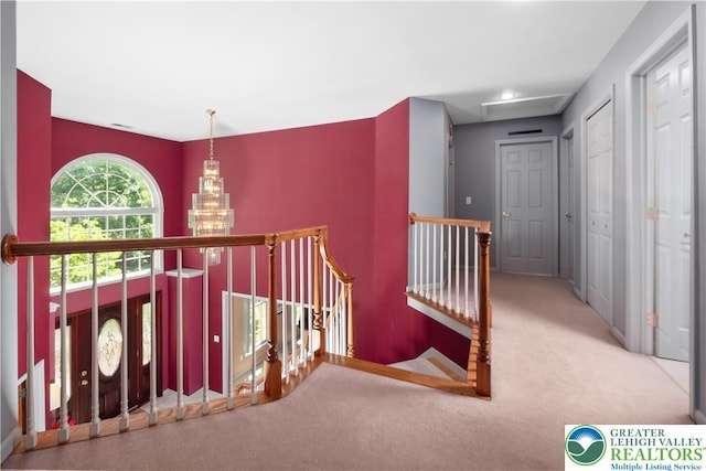 1224 Highland Dr, Upper Macungie Twp, PA 18069 - hallway with an upstairs landing, carpet flooring, a chandelier, and baseboards