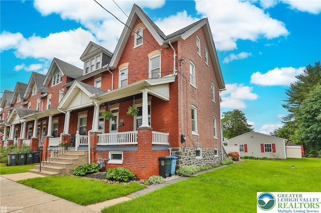 1116 Juniper St, Quakertown Boro, PA 18951 - multi unit property with brick siding, a porch, and a front lawn