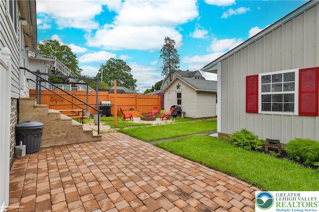 1116 Juniper St, Quakertown Boro, PA 18951 - view of patio / terrace with a fire pit, grilling area, an outdoor structure, and stairs