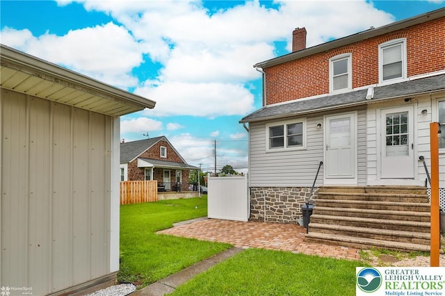 1116 Juniper St, Quakertown Boro, PA 18951 - rear view of house with entry steps and a chimney