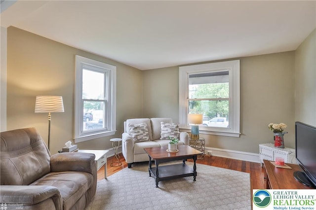 1116 Juniper St, Quakertown Boro, PA 18951 - living room featuring plenty of natural light, wood finished floors, and baseboards
