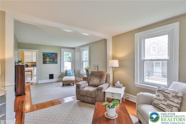 1116 Juniper St, Quakertown Boro, PA 18951 - living room featuring wood finished floors and baseboards