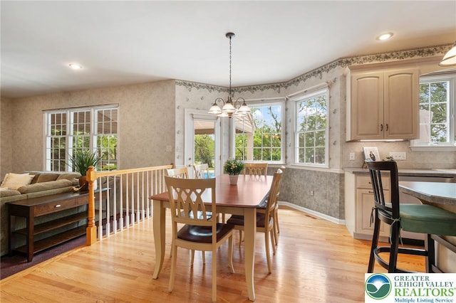 168 Forsythia Ln, Upper Macungie Twp, PA 18104 - dining area featuring healthy amount of natural light, a chandelier, light wood finished floors, wallpapered walls, and recessed lighting