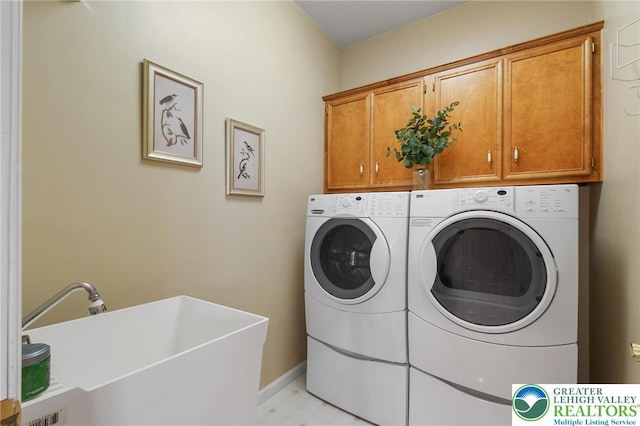 168 Forsythia Ln, Upper Macungie Twp, PA 18104 - washroom featuring cabinet space, washer and dryer, baseboards, and light floors