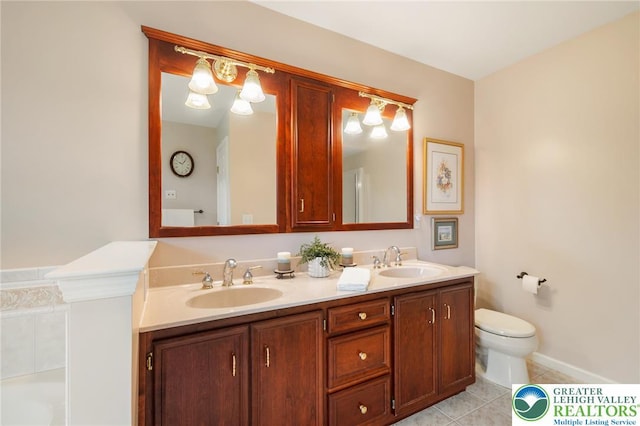 168 Forsythia Ln, Upper Macungie Twp, PA 18104 - bathroom with double vanity, tile patterned floors, toilet, and a tub