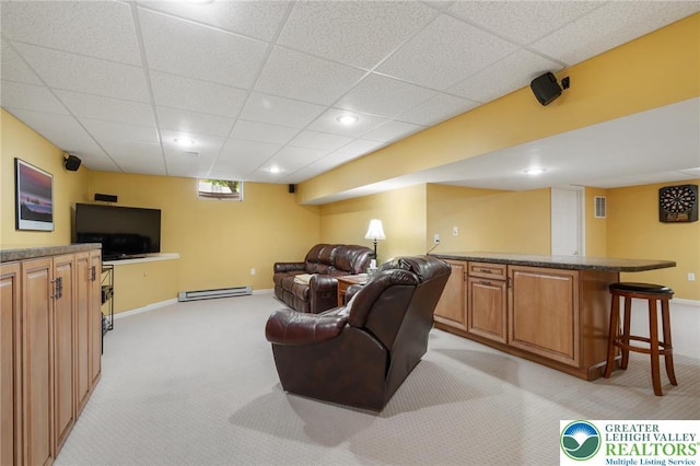 168 Forsythia Ln, Upper Macungie Twp, PA 18104 - living room with light carpet, a paneled ceiling, baseboards, and a baseboard heating unit