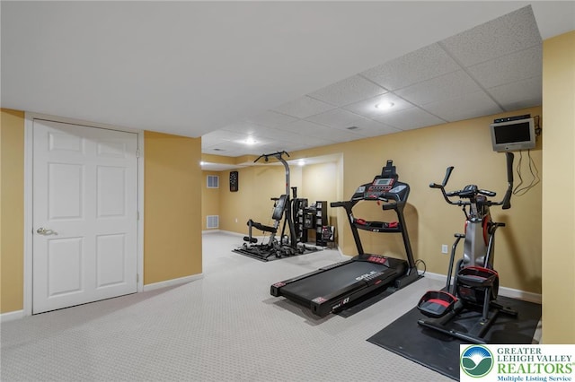 168 Forsythia Ln, Upper Macungie Twp, PA 18104 - workout room featuring carpet floors, baseboards, and a paneled ceiling