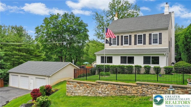 3139 Wilson Ave, Bethlehem Twp, PA 18020 - view of front of house featuring an outbuilding, a chimney, and a detached garage
