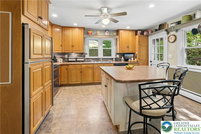 3139 Wilson Ave, Bethlehem Twp, PA 18020 - kitchen with healthy amount of natural light, a sink, a kitchen bar, a kitchen island, and recessed lighting
