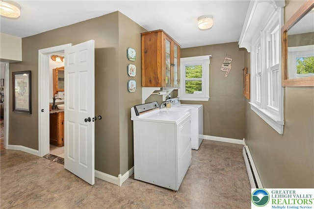 3139 Wilson Ave, Bethlehem Twp, PA 18020 - laundry room with a baseboard heating unit, cabinet space, washing machine and dryer, and baseboards
