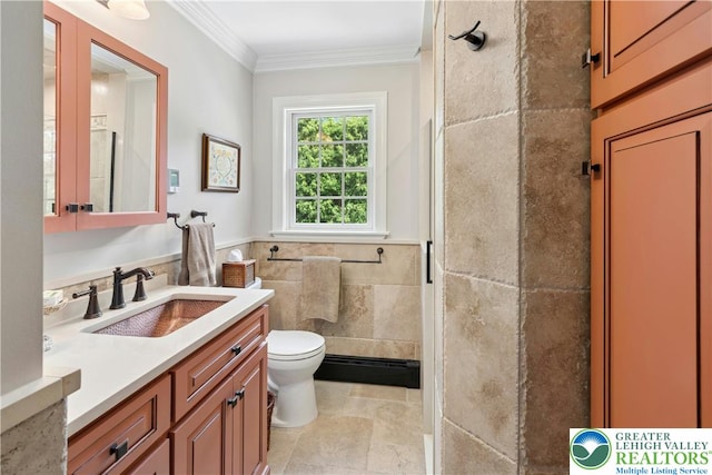 3139 Wilson Ave, Bethlehem Twp, PA 18020 - full bathroom featuring toilet, vanity, a baseboard heating unit, ornamental molding, and tile walls